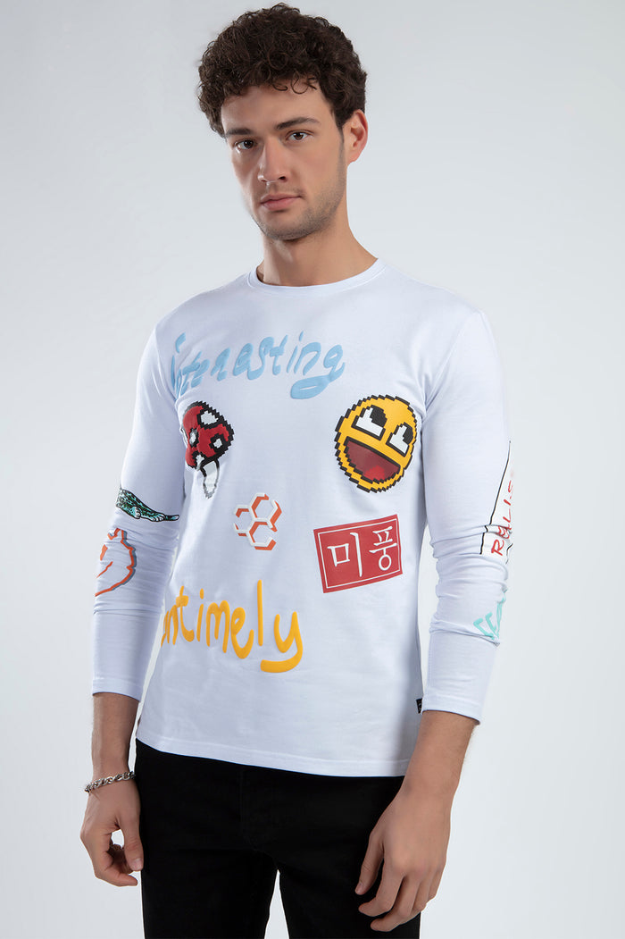 Model wearing the Untimely white long-sleeve streetwear shirt featuring pixel art graphics and colorful urban prints.