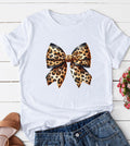 White short sleeve graphic top with a large leopard print bow design centered on the front.
